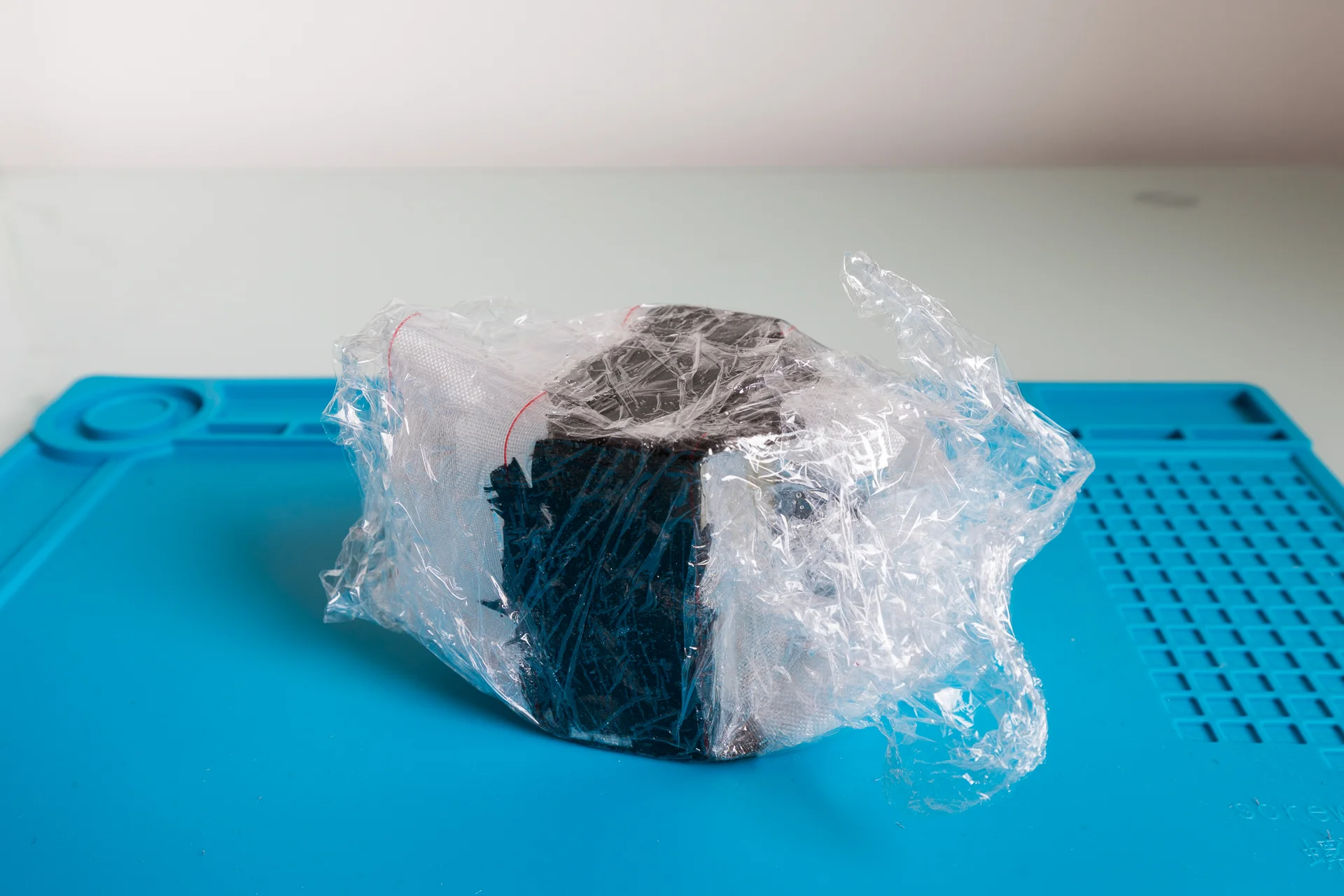 Nixie clock enclosure coated with carbon flakes and epoxy